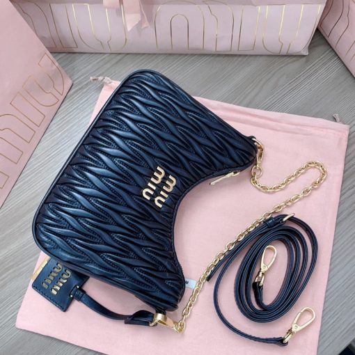 MIU MIU Matelassé Shoulder Bag. Authentic quality luxury bag crafted in genuine leather comes with authenticity card, dust bag and gift bag. Elevate your style with sophistication and craftsmanship. The exquisite matelassé technique exudes elegance and creates a visually captivating, multi-dimensional effect on this nappa leather shoulder bag. The beautifully crafted logo, reflecting the various metallic finishes of the hardware, effortlessly catches the eye, adding a touch of distinction to the immaculate artisanal work. Both functional and aesthetically pleasing, the detachable chain and leather shoulder straps perfectly meet your needs.