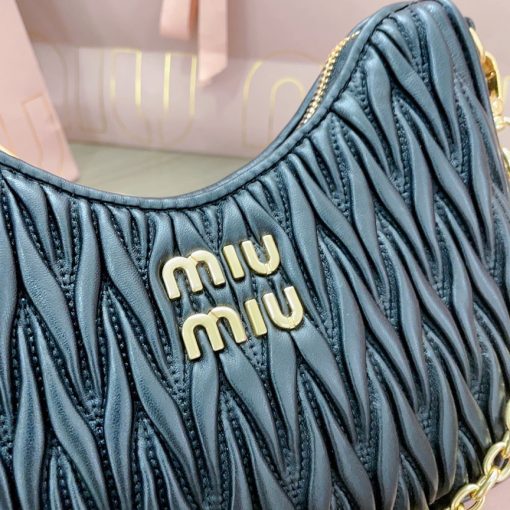 MIU MIU Matelassé Shoulder Bag. Authentic quality luxury bag crafted in genuine leather comes with authenticity card, dust bag and gift bag. Elevate your style with sophistication and craftsmanship. The exquisite matelassé technique exudes elegance and creates a visually captivating, multi-dimensional effect on this nappa leather shoulder bag. The beautifully crafted logo, reflecting the various metallic finishes of the hardware, effortlessly catches the eye, adding a touch of distinction to the immaculate artisanal work. Both functional and aesthetically pleasing, the detachable chain and leather shoulder straps perfectly meet your needs.