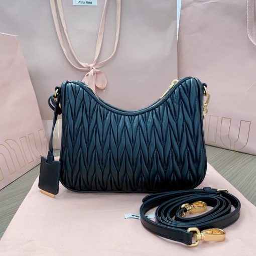 MIU MIU Matelassé Shoulder Bag. Authentic quality luxury bag crafted in genuine leather comes with authenticity card, dust bag and gift bag. Elevate your style with sophistication and craftsmanship. The exquisite matelassé technique exudes elegance and creates a visually captivating, multi-dimensional effect on this nappa leather shoulder bag. The beautifully crafted logo, reflecting the various metallic finishes of the hardware, effortlessly catches the eye, adding a touch of distinction to the immaculate artisanal work. Both functional and aesthetically pleasing, the detachable chain and leather shoulder straps perfectly meet your needs.