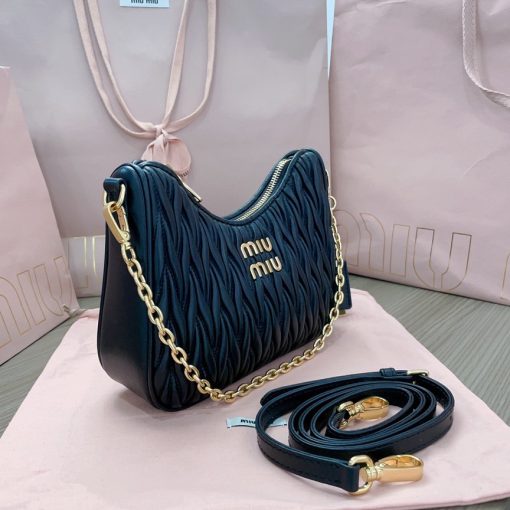 MIU MIU Matelassé Shoulder Bag. Authentic quality luxury bag crafted in genuine leather comes with authenticity card, dust bag and gift bag. Elevate your style with sophistication and craftsmanship. The exquisite matelassé technique exudes elegance and creates a visually captivating, multi-dimensional effect on this nappa leather shoulder bag. The beautifully crafted logo, reflecting the various metallic finishes of the hardware, effortlessly catches the eye, adding a touch of distinction to the immaculate artisanal work. Both functional and aesthetically pleasing, the detachable chain and leather shoulder straps perfectly meet your needs.