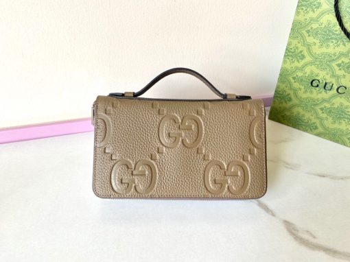 GUCCI Jumbo GG Travel Document Case. Authentic quality luxury bag crafted in genuine leather comes with authenticity card, dust bag and gift bag. Embrace Timeless Luxury: Secure Your Journey with Iconic GG Document Case. The iconic GG design makes a comeback for Pre-Fall 2023, adorning a range of small leather items. Paying homage to Guccio Gucci's initials, this motif remains timeless for the brand, showcased prominently in a large size to create a striking logo effect. In this particular case, the emblematic leather defines a travel document holder, ensuring security with a zip closure.