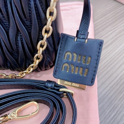 MIU MIU Matelassé Shoulder Bag. Authentic quality luxury bag crafted in genuine leather comes with authenticity card, dust bag and gift bag. Elevate your style with sophistication and craftsmanship. The exquisite matelassé technique exudes elegance and creates a visually captivating, multi-dimensional effect on this nappa leather shoulder bag. The beautifully crafted logo, reflecting the various metallic finishes of the hardware, effortlessly catches the eye, adding a touch of distinction to the immaculate artisanal work. Both functional and aesthetically pleasing, the detachable chain and leather shoulder straps perfectly meet your needs.