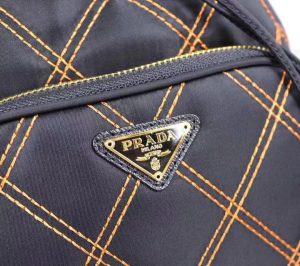 PRADA Quilted Bucket Bag. Authentic quality luxury bag crafted in genuine leather comes with authenticity card, dust bag and gift bag. Elevating Style with Quilted Luxury. Introducing the exquisite PRADA nylon bucket bag, featuring tessuto-impunturato quilted topstitching for a luxurious touch. Designed with a sleek leather top handle, this bag showcases a convenient drawstring top closure for easy access. It also includes a detachable shoulder strap, allowing for versatile carrying options. The front zip pocket, adorned with an elegant logo plate, adds a chic element to this stunning bag. - KRIS + KIKO PRADA Quilted Bucket Bag. Authentic quality luxury bag crafted in genuine leather comes with authenticity card, dust bag and gift bag. Elevating Style with Quilted Luxury. Introducing the exquisite PRADA nylon bucket bag, featuring tessuto-impunturato quilted topstitching for a luxurious touch. Designed with a sleek leather top handle, this bag showcases a convenient drawstring top closure for easy access. It also includes a detachable shoulder strap, allowing for versatile carrying options. The front zip pocket, adorned with an elegant logo plate, adds a chic element to this stunning bag.