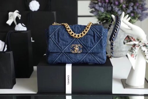 CHANEL'19' Flap Bag in Blue Denim 2020. Authentic quality luxury bag crafted in genuine leather comes with authenticity card, dust bag and gift bag. A fashion treasure worth investing in! Introducing the stunning Chanel '19' Flap Bag in Blue Denim, a true treasure coveted by fashion enthusiasts worldwide. With its impeccable design and undeniable trendiness, this bag is a must-have item for any fashion-forward individual. Rest assured, this bag is guaranteed to be authentic and comes with a proof of purchase. Please note that this particular bag is the Larger size, distinguishing it from the medium variant. Its global popularity has led to its complete sold-out status. Regrettably, this style is no longer being produced by Chanel and has been discontinued in denim. Owning this remarkable piece would not only enhance your wardrobe but also serve as a wise investment choice.