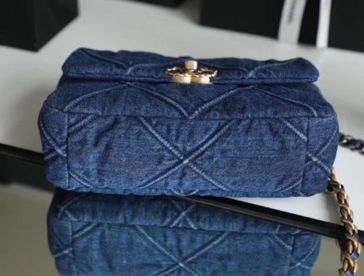 CHANEL'19' Flap Bag in Blue Denim 2020. Authentic quality luxury bag crafted in genuine leather comes with authenticity card, dust bag and gift bag. A fashion treasure worth investing in! Introducing the stunning Chanel '19' Flap Bag in Blue Denim, a true treasure coveted by fashion enthusiasts worldwide. With its impeccable design and undeniable trendiness, this bag is a must-have item for any fashion-forward individual. Rest assured, this bag is guaranteed to be authentic and comes with a proof of purchase. Please note that this particular bag is the Larger size, distinguishing it from the medium variant. Its global popularity has led to its complete sold-out status. Regrettably, this style is no longer being produced by Chanel and has been discontinued in denim. Owning this remarkable piece would not only enhance your wardrobe but also serve as a wise investment choice.