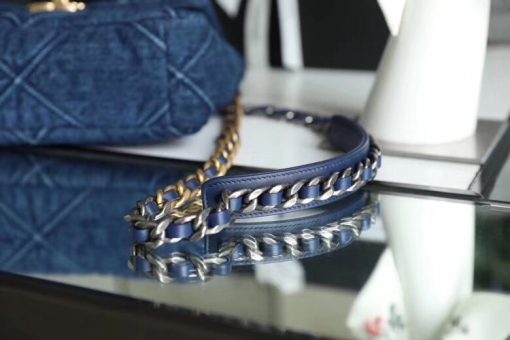 CHANEL'19' Flap Bag in Blue Denim 2020. Authentic quality luxury bag crafted in genuine leather comes with authenticity card, dust bag and gift bag. A fashion treasure worth investing in! Introducing the stunning Chanel '19' Flap Bag in Blue Denim, a true treasure coveted by fashion enthusiasts worldwide. With its impeccable design and undeniable trendiness, this bag is a must-have item for any fashion-forward individual. Rest assured, this bag is guaranteed to be authentic and comes with a proof of purchase. Please note that this particular bag is the Larger size, distinguishing it from the medium variant. Its global popularity has led to its complete sold-out status. Regrettably, this style is no longer being produced by Chanel and has been discontinued in denim. Owning this remarkable piece would not only enhance your wardrobe but also serve as a wise investment choice.