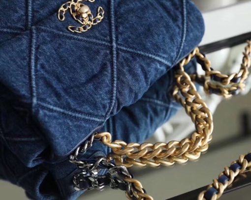 CHANEL'19' Flap Bag in Blue Denim 2020. Authentic quality luxury bag crafted in genuine leather comes with authenticity card, dust bag and gift bag. A fashion treasure worth investing in! Introducing the stunning Chanel '19' Flap Bag in Blue Denim, a true treasure coveted by fashion enthusiasts worldwide. With its impeccable design and undeniable trendiness, this bag is a must-have item for any fashion-forward individual. Rest assured, this bag is guaranteed to be authentic and comes with a proof of purchase. Please note that this particular bag is the Larger size, distinguishing it from the medium variant. Its global popularity has led to its complete sold-out status. Regrettably, this style is no longer being produced by Chanel and has been discontinued in denim. Owning this remarkable piece would not only enhance your wardrobe but also serve as a wise investment choice.