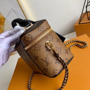 LOUIS VUITTON Vanity PM Case. Authentic quality luxury bag crafted in genuine leather comes with authenticity card, dust bag and gift bag. Elevate your style and embrace the spirit of travel with the revamped Nice Vanity Kit. Nicolas Ghesquière's vision for 2020 brings a delightful tribute to LOUIS VUITTON's timeless travel legacy. Behold, an exquisite reinvention of the classic Nice vanity kit, transformed into a chic city bag crafted with Monogram and Monogram Reverse canvases. This masterpiece is designed to be effortlessly portable, boasting a lightweight and supple structure that allows it to accompany you wherever you go. The bag can be gracefully carried in your hand, elegantly slung over your shoulder, or worn across your body, thanks to its removable leather-chain strap. - KRIS + KIKO LOUIS VUITTON Vanity PM Case. Authentic quality luxury bag crafted in genuine leather comes with authenticity card, dust bag and gift bag. Elevate your style and embrace the spirit of travel with the revamped Nice Vanity Kit. Nicolas Ghesquière's vision for 2020 brings a delightful tribute to LOUIS VUITTON's timeless travel legacy. Behold, an exquisite reinvention of the classic Nice vanity kit, transformed into a chic city bag crafted with Monogram and Monogram Reverse canvases. This masterpiece is designed to be effortlessly portable, boasting a lightweight and supple structure that allows it to accompany you wherever you go. The bag can be gracefully carried in your hand, elegantly slung over your shoulder, or worn across your body, thanks to its removable leather-chain strap.
