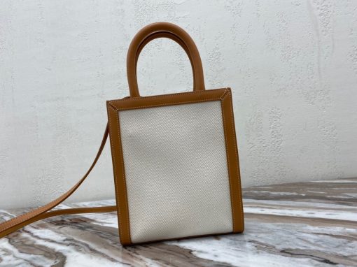 CELINE Cabas Triomphe Mini. Authentic quality luxury bag crafted in genuine leather comes with authenticity card, dust bag and gift bag. Elegance Meets Iconic Design The Triomphe bag initially had a lukewarm reception, but it is now steadily gaining attention and recognition. The origins of its story can be traced back to the stunning CELINE Triomphe bag, which pays homage to the iconic Arc de Triomphe. Embarking on a new chapter, CELINE has crafted an entire collection dedicated to the Triomphe line. This collection comprises a tote bag, bucket bag, camera bag, drawstring bag, and a Boston bag, all meticulously crafted from Triomphe canvas adorned with exquisite calfskin trimming.