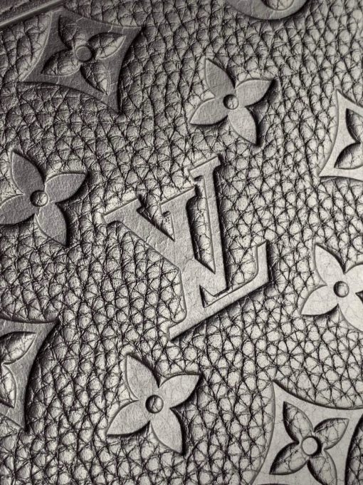 LOUIS VUITTON Soft Trunk Clutch. Authentic quality luxury bag crafted in genuine leather comes with authenticity card, dust bag and gift bag. Practical elegance for the modern gentleman. Introducing the sleek Soft Trunk Clutch designed specifically for men. Meticulously crafted from luxurious black Taurillon leather, this exquisite accessory features an embossed Monogram pattern. Boasting a refined rectilinear form and compact dimensions, it effortlessly accommodates your essential items such as a phone, earbuds, and credit cards. With a wide zipped opening for easy access and a removable wristband, it provides utmost practicality and convenience.