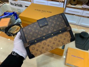 LOUIS VUITTON Trunk Clutch. Authentic quality luxury bag crafted in genuine leather comes with authenticity card, dust bag and gift bag. Style meets functionality in perfect harmony. The Trunk Clutch, designed with a soft-sided silhouette, pays homage to the rich heritage of the House, showcasing exquisite details reminiscent of the iconic LOUIS VUITTON luggage. Crafted in supple yet firm Monogram and Monogram Reverse canvas, this clutch effortlessly combines style with practicality, offering ample space to carry your everyday essentials. Its lightweight nature adds to its charm, making it an essential accessory. Additionally, the clutch features a detachable chain-and-leather strap, providing you with multiple carrying options for this fashionable and distinctive masterpiece. - KRIS + KIKO LOUIS VUITTON Trunk Clutch. Authentic quality luxury bag crafted in genuine leather comes with authenticity card, dust bag and gift bag. Style meets functionality in perfect harmony. The Trunk Clutch, designed with a soft-sided silhouette, pays homage to the rich heritage of the House, showcasing exquisite details reminiscent of the iconic LOUIS VUITTON luggage. Crafted in supple yet firm Monogram and Monogram Reverse canvas, this clutch effortlessly combines style with practicality, offering ample space to carry your everyday essentials. Its lightweight nature adds to its charm, making it an essential accessory. Additionally, the clutch features a detachable chain-and-leather strap, providing you with multiple carrying options for this fashionable and distinctive masterpiece.