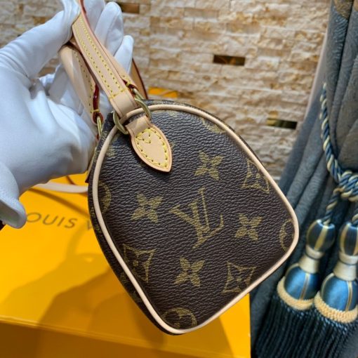 LOUIS VUITTON Nano Speedy Bag. Authentic quality luxury bag crafted in genuine leather comes with authenticity card, dust bag and gift bag. Effortless Chic for Everyday Essentials. This charming bag is a delightful miniature version of LOUIS VUITTON's iconic Speedy bag. Expertly crafted from Monogram canvas, with accents of natural leather trim, it boasts two handles and a convenient long strap for effortless shoulder or cross-body carry. Despite its compact size, this bag is surprisingly spacious, easily accommodating essentials such as a smartphone, cards, and keys. Its lightweight design adds to its allure, making it both practical and stylish for any occasion.