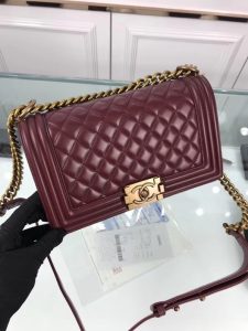 CHANEL 'Boy' Diamond Quilted Leather Flap Bag. Authentic quality luxury bag crafted in genuine leather comes with authenticity card, dust bag and gift bag. Embrace timeless elegance. The Chanel Boy Flap Bag Quilted, a creation by the visionary Karl Lagerfeld, pays tribute to Gabrielle Chanel's beloved Boy Capel. This exquisite bag, reminiscent of every woman's fantasy, is meticulously crafted from premium calfskin leather. It showcases Chanel's iconic diamond quilting, adorned with a bold chain link strap enhanced by a leather shoulder pad, and complemented by delicate metal-tone hardware accents. The bag's CC Boy logo closure gracefully reveals a fabric-lined interior, complete with a convenient slip pocket to house everyday essentials. Truly a cherished and opulent accessory coveted by many. - KRIS + KIKO CHANEL 'Boy' Diamond Quilted Leather Flap Bag. Authentic quality luxury bag crafted in genuine leather comes with authenticity card, dust bag and gift bag. Embrace timeless elegance. The Chanel Boy Flap Bag Quilted, a creation by the visionary Karl Lagerfeld, pays tribute to Gabrielle Chanel's beloved Boy Capel. This exquisite bag, reminiscent of every woman's fantasy, is meticulously crafted from premium calfskin leather. It showcases Chanel's iconic diamond quilting, adorned with a bold chain link strap enhanced by a leather shoulder pad, and complemented by delicate metal-tone hardware accents. The bag's CC Boy logo closure gracefully reveals a fabric-lined interior, complete with a convenient slip pocket to house everyday essentials. Truly a cherished and opulent accessory coveted by many.