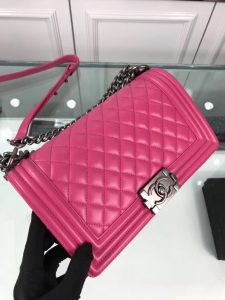 CHANEL 'Boy' Diamond Quilted Leather Flap Bag. Authentic quality luxury bag crafted in genuine leather comes with authenticity card, dust bag and gift bag. Embrace timeless elegance. The Chanel Boy Flap Bag Quilted, a creation by the visionary Karl Lagerfeld, pays tribute to Gabrielle Chanel's beloved Boy Capel. This exquisite bag, reminiscent of every woman's fantasy, is meticulously crafted from premium calfskin leather. It showcases Chanel's iconic diamond quilting, adorned with a bold chain link strap enhanced by a leather shoulder pad, and complemented by delicate metal-tone hardware accents. The bag's CC Boy logo closure gracefully reveals a fabric-lined interior, complete with a convenient slip pocket to house everyday essentials. Truly a cherished and opulent accessory coveted by many. - KRIS + KIKO CHANEL 'Boy' Diamond Quilted Leather Flap Bag. Authentic quality luxury bag crafted in genuine leather comes with authenticity card, dust bag and gift bag. Embrace timeless elegance. The Chanel Boy Flap Bag Quilted, a creation by the visionary Karl Lagerfeld, pays tribute to Gabrielle Chanel's beloved Boy Capel. This exquisite bag, reminiscent of every woman's fantasy, is meticulously crafted from premium calfskin leather. It showcases Chanel's iconic diamond quilting, adorned with a bold chain link strap enhanced by a leather shoulder pad, and complemented by delicate metal-tone hardware accents. The bag's CC Boy logo closure gracefully reveals a fabric-lined interior, complete with a convenient slip pocket to house everyday essentials. Truly a cherished and opulent accessory coveted by many.