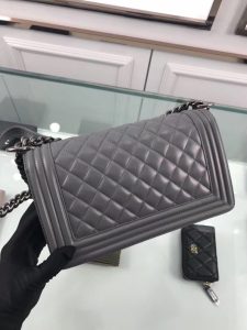 CHANEL 'Boy' Diamond Quilted Leather Flap Bag. Authentic quality luxury bag crafted in genuine leather comes with authenticity card, dust bag and gift bag. Embrace timeless elegance. The Chanel Boy Flap Bag Quilted, a creation by the visionary Karl Lagerfeld, pays tribute to Gabrielle Chanel's beloved Boy Capel. This exquisite bag, reminiscent of every woman's fantasy, is meticulously crafted from premium calfskin leather. It showcases Chanel's iconic diamond quilting, adorned with a bold chain link strap enhanced by a leather shoulder pad, and complemented by delicate metal-tone hardware accents. The bag's CC Boy logo closure gracefully reveals a fabric-lined interior, complete with a convenient slip pocket to house everyday essentials. Truly a cherished and opulent accessory coveted by many. - KRIS + KIKO CHANEL 'Boy' Diamond Quilted Leather Flap Bag. Authentic quality luxury bag crafted in genuine leather comes with authenticity card, dust bag and gift bag. Embrace timeless elegance. The Chanel Boy Flap Bag Quilted, a creation by the visionary Karl Lagerfeld, pays tribute to Gabrielle Chanel's beloved Boy Capel. This exquisite bag, reminiscent of every woman's fantasy, is meticulously crafted from premium calfskin leather. It showcases Chanel's iconic diamond quilting, adorned with a bold chain link strap enhanced by a leather shoulder pad, and complemented by delicate metal-tone hardware accents. The bag's CC Boy logo closure gracefully reveals a fabric-lined interior, complete with a convenient slip pocket to house everyday essentials. Truly a cherished and opulent accessory coveted by many.