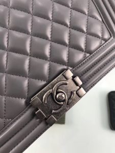 CHANEL 'Boy' Diamond Quilted Leather Flap Bag. Authentic quality luxury bag crafted in genuine leather comes with authenticity card, dust bag and gift bag. Embrace timeless elegance. The Chanel Boy Flap Bag Quilted, a creation by the visionary Karl Lagerfeld, pays tribute to Gabrielle Chanel's beloved Boy Capel. This exquisite bag, reminiscent of every woman's fantasy, is meticulously crafted from premium calfskin leather. It showcases Chanel's iconic diamond quilting, adorned with a bold chain link strap enhanced by a leather shoulder pad, and complemented by delicate metal-tone hardware accents. The bag's CC Boy logo closure gracefully reveals a fabric-lined interior, complete with a convenient slip pocket to house everyday essentials. Truly a cherished and opulent accessory coveted by many. - KRIS + KIKO CHANEL 'Boy' Diamond Quilted Leather Flap Bag. Authentic quality luxury bag crafted in genuine leather comes with authenticity card, dust bag and gift bag. Embrace timeless elegance. The Chanel Boy Flap Bag Quilted, a creation by the visionary Karl Lagerfeld, pays tribute to Gabrielle Chanel's beloved Boy Capel. This exquisite bag, reminiscent of every woman's fantasy, is meticulously crafted from premium calfskin leather. It showcases Chanel's iconic diamond quilting, adorned with a bold chain link strap enhanced by a leather shoulder pad, and complemented by delicate metal-tone hardware accents. The bag's CC Boy logo closure gracefully reveals a fabric-lined interior, complete with a convenient slip pocket to house everyday essentials. Truly a cherished and opulent accessory coveted by many.