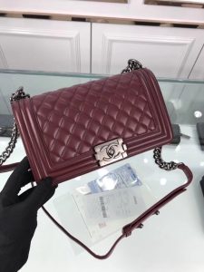 CHANEL 'Boy' Diamond Quilted Leather Flap Bag. Authentic quality luxury bag crafted in genuine leather comes with authenticity card, dust bag and gift bag. Embrace timeless elegance. The Chanel Boy Flap Bag Quilted, a creation by the visionary Karl Lagerfeld, pays tribute to Gabrielle Chanel's beloved Boy Capel. This exquisite bag, reminiscent of every woman's fantasy, is meticulously crafted from premium calfskin leather. It showcases Chanel's iconic diamond quilting, adorned with a bold chain link strap enhanced by a leather shoulder pad, and complemented by delicate metal-tone hardware accents. The bag's CC Boy logo closure gracefully reveals a fabric-lined interior, complete with a convenient slip pocket to house everyday essentials. Truly a cherished and opulent accessory coveted by many. - KRIS + KIKO CHANEL 'Boy' Diamond Quilted Leather Flap Bag. Original Quality Bag including gift box, care book, dust bag, authenticity card. Created by Karl Lagerfeld, the iconic design owes its name to Gabrielle Chanel's first love, Boy Capel. This Chanel Boy Flap Bag Quilted is every woman's dream. Crafted from calfskin leather, the bag features Chanel's signature diamond quilting, chunky chain link strap with leather shoulder pad, and metal-tone hardware accents. Its CC Boy logo closure opens to a fabric-lined interior with slip pocket perfect for daily essentials. A sought-after, luxurious accessory.