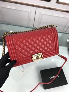 CHANEL 'Boy' Diamond Quilted Leather Flap Bag. Authentic quality luxury bag crafted in genuine leather comes with authenticity card, dust bag and gift bag. Embrace timeless elegance. The Chanel Boy Flap Bag Quilted, a creation by the visionary Karl Lagerfeld, pays tribute to Gabrielle Chanel's beloved Boy Capel. This exquisite bag, reminiscent of every woman's fantasy, is meticulously crafted from premium calfskin leather. It showcases Chanel's iconic diamond quilting, adorned with a bold chain link strap enhanced by a leather shoulder pad, and complemented by delicate metal-tone hardware accents. The bag's CC Boy logo closure gracefully reveals a fabric-lined interior, complete with a convenient slip pocket to house everyday essentials. Truly a cherished and opulent accessory coveted by many. - KRIS + KIKO CHANEL 'Boy' Diamond Quilted Leather Flap Bag. Original Quality Bag including gift box, care book, dust bag, authenticity card. Created by Karl Lagerfeld, the iconic design owes its name to Gabrielle Chanel's first love, Boy Capel. This Chanel Boy Flap Bag Quilted is every woman's dream. Crafted from calfskin leather, the bag features Chanel's signature diamond quilting, chunky chain link strap with leather shoulder pad, and metal-tone hardware accents. Its CC Boy logo closure opens to a fabric-lined interior with slip pocket perfect for daily essentials. A sought-after, luxurious accessory.