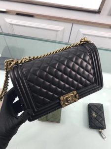 CHANEL 'Boy' Diamond Quilted Leather Flap Bag. Authentic quality luxury bag crafted in genuine leather comes with authenticity card, dust bag and gift bag. Embrace timeless elegance. The Chanel Boy Flap Bag Quilted, a creation by the visionary Karl Lagerfeld, pays tribute to Gabrielle Chanel's beloved Boy Capel. This exquisite bag, reminiscent of every woman's fantasy, is meticulously crafted from premium calfskin leather. It showcases Chanel's iconic diamond quilting, adorned with a bold chain link strap enhanced by a leather shoulder pad, and complemented by delicate metal-tone hardware accents. The bag's CC Boy logo closure gracefully reveals a fabric-lined interior, complete with a convenient slip pocket to house everyday essentials. Truly a cherished and opulent accessory coveted by many. - KRIS + KIKO CHANEL 'Boy' Diamond Quilted Leather Flap Bag. Authentic quality luxury bag crafted in genuine leather comes with authenticity card, dust bag and gift bag. Embrace timeless elegance. The Chanel Boy Flap Bag Quilted, a creation by the visionary Karl Lagerfeld, pays tribute to Gabrielle Chanel's beloved Boy Capel. This exquisite bag, reminiscent of every woman's fantasy, is meticulously crafted from premium calfskin leather. It showcases Chanel's iconic diamond quilting, adorned with a bold chain link strap enhanced by a leather shoulder pad, and complemented by delicate metal-tone hardware accents. The bag's CC Boy logo closure gracefully reveals a fabric-lined interior, complete with a convenient slip pocket to house everyday essentials. Truly a cherished and opulent accessory coveted by many.