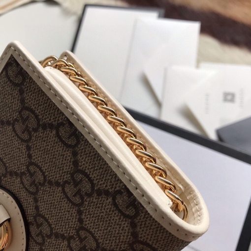GUCCI 1955 GG Supreme Horsebit Wallet On Chain. Authentic quality luxury bag crafted in genuine leather comes with authenticity card, dust bag and gift bag. Unlock the essence of timeless elegance. Introducing the chain wallet from Gucci's esteemed Horsebit 1955 accessories collection, crafted with GG Supreme canvas and leather. This exquisite piece showcases the iconic double ring and bar design found in their esteemed Handbags line. The wallet's sleek snap-closure shape reveals numerous card slots and pockets, offering practicality alongside style. Furthermore, it boasts a detachable chain strap, adding versatility to its elegant design.