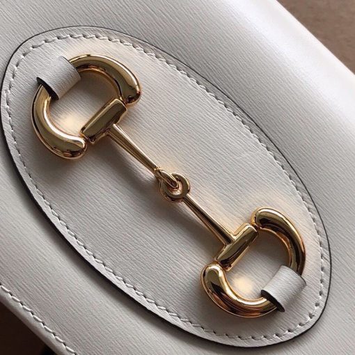 GUCCI 1955 GG Supreme Horsebit Wallet On Chain. Original Quality Wallet including gift box, care book, dust bag, authenticity card. This chain wallet in GG Supreme canvas and leather is introduced as part of the Gucci Horsebit 1955 accessories collection, defined by the double ring and bar design also found in Handbags. The folded snap-closure shape features several card slots and pockets, completed with a detachable chain strap.
