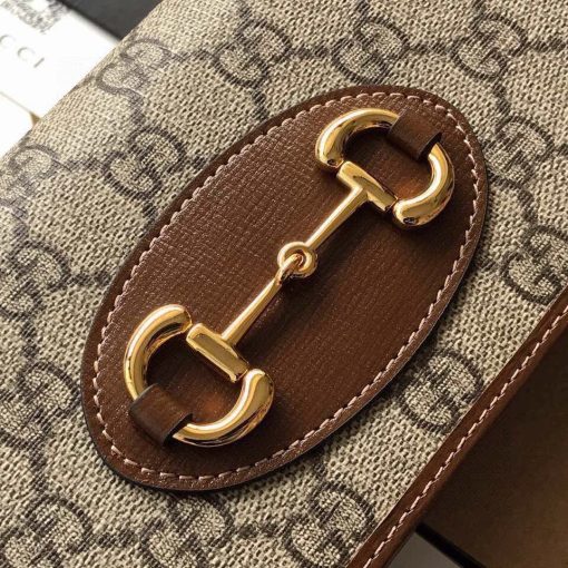 GUCCI 1955 GG Supreme Horsebit Wallet On Chain. Original Quality Wallet including gift box, care book, dust bag, authenticity card. This chain wallet in GG Supreme canvas and leather is introduced as part of the Gucci Horsebit 1955 accessories collection, defined by the double ring and bar design also found in Handbags. The folded snap-closure shape features several card slots and pockets, completed with a detachable chain strap.