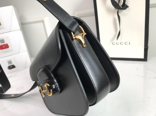 GUCCI 1955 Horsebit Shoulder Bag. Authentic quality luxury bag crafted in genuine leather comes with authenticity card, dust bag and gift bag. Timeless Design, Modern Spirit. The Gucci Horsebit 1955 bag, introduced for Cruise 2020, is a reimagined version of an archival design. This accessory combines classic elements with a modern twist, showcasing the iconic Horsebit hardware. The bag features a small flap shoulder design with an adjustable strap, allowing for versatile wear. It is crafted with Gucci's monogram fabric and embodies the individual spirit of the House.