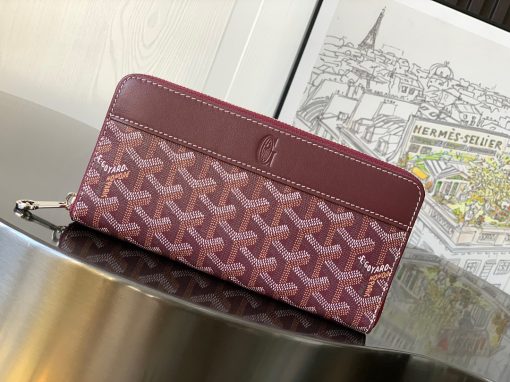 GOYARD Matignon GM Wallet. Authentic quality luxury bag crafted in genuine leather comes with authenticity card, dust bag and gift bag. A Statement of Elegance and Functionality. Experience luxury and functionality with the Goyard Matignon GM Wallet. Crafted from premium calf leather and Goyardine canvas, it offers twelve card slots, a zipper pocket, and two spacious compartments, all secured by a snap button closure. Handcrafted by skilled artisans, Whether you're running errands or gracing a formal occasion, this wallet is the ultimate style companion. Choose from an array of colors to reflect your personality and elevate your ensemble. With this wallet, you'll not only radiate elegance but also experience unparalleled functionality.