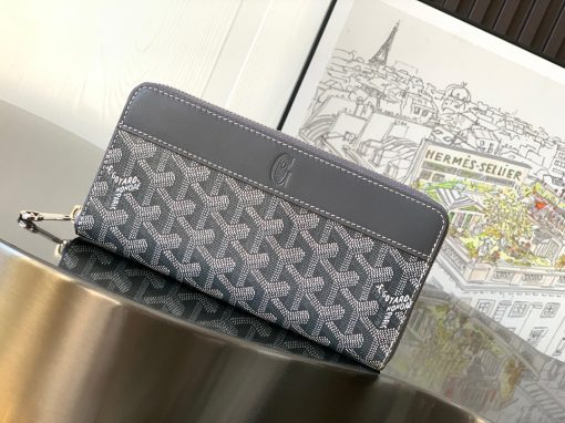 GOYARD Matignon GM Wallet. Authentic quality luxury bag crafted in genuine leather comes with authenticity card, dust bag and gift bag. A Statement of Elegance and Functionality. Experience luxury and functionality with the Goyard Matignon GM Wallet. Crafted from premium calf leather and Goyardine canvas, it offers twelve card slots, a zipper pocket, and two spacious compartments, all secured by a snap button closure. Handcrafted by skilled artisans, Whether you're running errands or gracing a formal occasion, this wallet is the ultimate style companion. Choose from an array of colors to reflect your personality and elevate your ensemble. With this wallet, you'll not only radiate elegance but also experience unparalleled functionality.