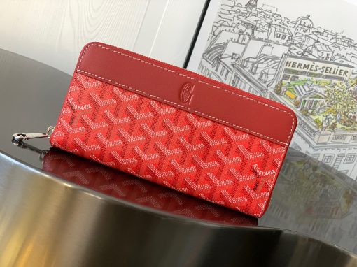 GOYARD Matignon GM Wallet. Authentic quality luxury bag crafted in genuine leather comes with authenticity card, dust bag and gift bag. A Statement of Elegance and Functionality. Experience luxury and functionality with the Goyard Matignon GM Wallet. Crafted from premium calf leather and Goyardine canvas, it offers twelve card slots, a zipper pocket, and two spacious compartments, all secured by a snap button closure. Handcrafted by skilled artisans, Whether you're running errands or gracing a formal occasion, this wallet is the ultimate style companion. Choose from an array of colors to reflect your personality and elevate your ensemble. With this wallet, you'll not only radiate elegance but also experience unparalleled functionality.