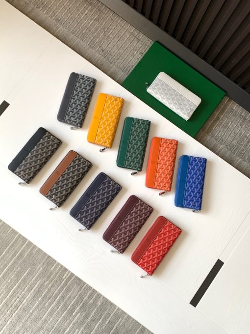 GOYARD Matignon GM Wallet. Authentic quality luxury bag crafted in genuine leather comes with authenticity card, dust bag and gift bag. A Statement of Elegance and Functionality. Experience luxury and functionality with the Goyard Matignon GM Wallet. Crafted from premium calf leather and Goyardine canvas, it offers twelve card slots, a zipper pocket, and two spacious compartments, all secured by a snap button closure. Handcrafted by skilled artisans, Whether you're running errands or gracing a formal occasion, this wallet is the ultimate style companion. Choose from an array of colors to reflect your personality and elevate your ensemble. With this wallet, you'll not only radiate elegance but also experience unparalleled functionality.