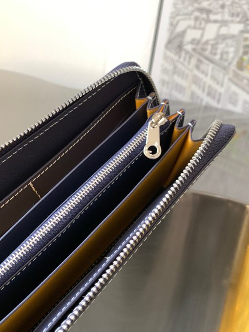 GOYARD Matignon GM Wallet. Authentic quality luxury bag crafted in genuine leather comes with authenticity card, dust bag and gift bag. A Statement of Elegance and Functionality. Experience luxury and functionality with the Goyard Matignon GM Wallet. Crafted from premium calf leather and Goyardine canvas, it offers twelve card slots, a zipper pocket, and two spacious compartments, all secured by a snap button closure. Handcrafted by skilled artisans, Whether you're running errands or gracing a formal occasion, this wallet is the ultimate style companion. Choose from an array of colors to reflect your personality and elevate your ensemble. With this wallet, you'll not only radiate elegance but also experience unparalleled functionality.