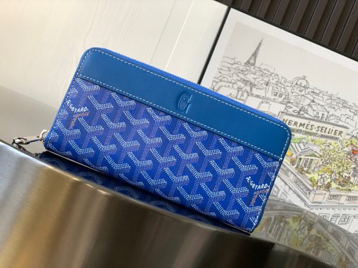 GOYARD Matignon GM Wallet. Authentic quality luxury bag crafted in genuine leather comes with authenticity card, dust bag and gift bag. A Statement of Elegance and Functionality. Experience luxury and functionality with the Goyard Matignon GM Wallet. Crafted from premium calf leather and Goyardine canvas, it offers twelve card slots, a zipper pocket, and two spacious compartments, all secured by a snap button closure. Handcrafted by skilled artisans, Whether you're running errands or gracing a formal occasion, this wallet is the ultimate style companion. Choose from an array of colors to reflect your personality and elevate your ensemble. With this wallet, you'll not only radiate elegance but also experience unparalleled functionality.