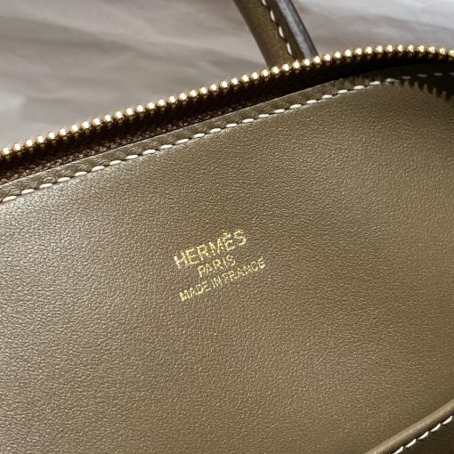 HERMÈS Bolide 1923 Mini. Authentic quality luxury bag crafted in genuine leather comes with authenticity card, dust bag and gift bag. Timeless Elegance, Unparalleled Convenience: The Bolide Bag – A Journey in Every Stitch. Created in 1923 with the discerning needs of elite drivers and seasoned long-distance travelers in mind, this globe-trotting bag effortlessly finds its place within any automobile trunk. Its iconic round-angled shape owes its origins to the zip fastener, a novel invention introduced to France by Émile Hermès in the late 1910s, and this innovative feature enables swift access to its contents. The Bolide bag is available in various sizes, including a travel-sized version, and a range of handbag options, offering both style and functionality to its fortunate owners.