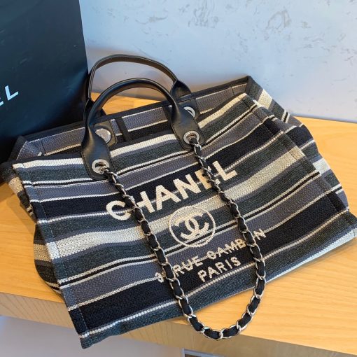 CHANEL Large Deauville Shopping Bag 2021. Authentic quality luxury bag crafted in genuine leather comes with authenticity card, dust bag and gift bag. Classic Elegance Meets Enduring Style. The CHANEL Deauville tote has evolved into an iconic CHANEL bag, gaining recognition as a popular choice. It frequently makes appearances in seasonal collections, showcasing surprising hues and materials. Interestingly, on the CHANEL website, it is referred to as the Shopping Bag; however, if you visit a CHANEL boutique and inquire about the Deauville, you will be guided to this exquisite tote bag.