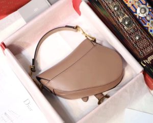 DIOR Saddle Shoulder Bag. Authentic quality luxury bag crafted in genuine leather comes with authenticity card, dust bag and gift bag. Equestrian-inspired luxury, crafted for timeless style. It was originally introduced by designer John Galliano in the late 1990s and has since become an iconic accessory in the fashion world. The bag features a unique curved shape resembling a horse saddle, hence the name. It is crafted from high-quality materials such as smooth calfskin or the classic Dior Oblique canvas, and often adorned with the brand's signature logo hardware. The bag can be worn crossbody or over the shoulder, offering versatility and functionality. With its timeless design and elegant aesthetic, the DIOR Saddle Shoulder Bag has gained a cult following and remains a coveted item among fashion enthusiasts. - KRIS + KIKO DIOR Saddle Shoulder Bag. Original Quality Bag. Authentic Style. Genuine Calf Leather. Metal Hardware. Authentic Packaging. Original Quality Dust Bag.