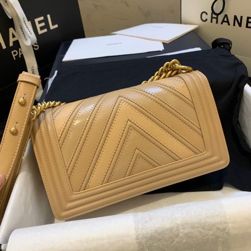 CHANEL Medium Chevron Mix Leather Boy Bag. Authentic quality luxury bag crafted in genuine leather comes with authenticity card, dust bag and gift bag. Elevate your style with iconic Boy Bag - the epitome of luxury and sophistication! Chanel is proudly presenting a fresh and captivating design for their beloved Boy Bag. As part of their remarkable Spring/Summer 2016 Collection, this exquisitely crafted handbag is skillfully adorned with a delightful combination of three luxurious leathers: Calfskin, Suede Calfskin, and Grained Calfskin. Its gilded metal handle-chain gives you the freedom to carry it gracefully in your hand or elegantly on your shoulder. This sensational shoulder bag not only embodies style but also offers the perfect size to carry your essential belongings, making it the ultimate choice for any occasion, day or night. Indulge in the timeless allure of Chanel with this exquisite piece!