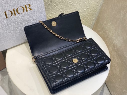 DIOR Miss Dior Top Handle Bag. Authentic quality luxury bag crafted in genuine leather comes with authenticity card, dust bag and gift bag. Your Day to Evening Essential. Elegance in Every Detail. Introducing the latest addition to the Cruise 2024 collection, the Miss Dior Top Handle bag embodies an exquisite blend of sophistication and functionality. Meticulously fashioned from luxurious black lambskin adorned with meticulous Cannage stitching, this bag showcases a gracefully adorned flap adorned by a captivating D.I.O.R. charm. Beneath this flap, you'll discover two spacious compartments and a secure zipped pouch, designed to effortlessly accommodate all your essentials, whether it's day or night. The signature Top Handle of this bag is both elegant and versatile, featuring a removable chain strap with a leather insert. This thoughtful design allows you to carry it comfortably in hand, wear it gracefully over your shoulder, or effortlessly sling it across your body for a stylish and adaptable look.