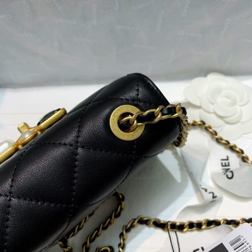 CHANEL Small Flap Bag with Crystal Pearls and Resin. Authentic quality luxury bag crafted in genuine leather comes with authenticity card, dust bag and gift bag. Captivating Complexity: Embrace Subtle Glamour with Chanel's Bejeweled Small Flap Bag. Chanel has unveiled an exquisite addition to their Fall-Winter 2020/21 collection: the Small Flap Bag, now adorned with dazzling jewels. This delicately glamorous bag showcases the elegance of faux pearls and Chanel's renowned Gripoix, crafted from poured glass, beautifully embellishing its clasp.