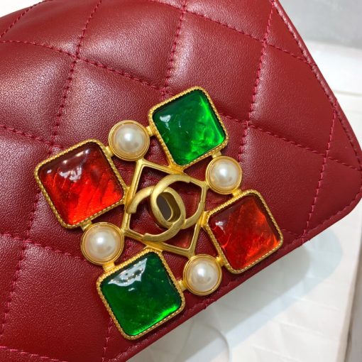 CHANEL Small Flap Bag with Crystal Pearls and Resin. Authentic quality luxury bag crafted in genuine leather comes with authenticity card, dust bag and gift bag. Captivating Complexity: Embrace Subtle Glamour with Chanel's Bejeweled Small Flap Bag. Chanel has unveiled an exquisite addition to their Fall-Winter 2020/21 collection: the Small Flap Bag, now adorned with dazzling jewels. This delicately glamorous bag showcases the elegance of faux pearls and Chanel's renowned Gripoix, crafted from poured glass, beautifully embellishing its clasp.