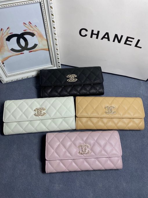 CHANEL CC Logo Flap Wallet. Authentic quality luxury bag crafted in genuine leather comes with authenticity card, dust bag and gift bag. Luxury meets practicality. Introducing the exquisite CHANEL wallet, meticulously fashioned with opulent quilted grained calfskin embellished by the iconic CC logo. Unlocking its magnetic allure reveals a sumptuous leather interior adorned with convenient card slots and a secure zippered compartment.