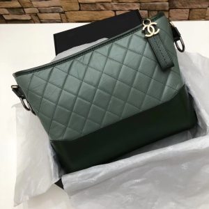 CHANEL Gabrielle Leather Hobo Bag. Original Quality Bag including gift box, care book, dust bag, authenticity card. As stated by Karl Lagerfeld in an exclusive Chanel video, this latest bag style is really meant to pay homage Chanel’s founder, Gabrielle Bonheur “Coco” Chanel: “Everyone called her Coco but her real name was Gabrielle. It’s the perfect name for a handbag that has all the codes of Chanel.” We agree with Lagerfeld. The Gabrielle hits the mark on everything “perfectly Chanel”, with a fresh, bold twist.” The Chanel Gabrielle bag is inspired by virtual reality glasses and the binocular cases men used to wear over their shoulders at the racecourse. The bag features other iconic Chanel elements like quilting and a big CC logo, but overall this bag is supposed to have a futuristic edge as seen by its boxy shape. According to literature from Chanel, the experience of carrying the Gabrielle bag is truly unique. Its double straps can be passed over the head, like a sweater, and circled around the neck and shoulder nonchalantly, like a long necklace. Karl Lagerfeld even goes as far to state that “the handbag has a strong look, so the people who represent it have strong looks and personalities.”