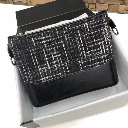 CHANEL Gabrielle Leather Hobo Bag. Authentic quality luxury bag crafted in genuine leather comes with authenticity card, dust bag and gift bag. Embodying the Future of Chanel with a Bold and Unforgettable Style. In an exclusive Chanel video, Karl Lagerfeld expressed his belief that the latest bag style, the Gabrielle, pays homage to Chanel's founder, Gabrielle Bonheur "Coco" Chanel. Lagerfeld explained that while she was known as Coco, her real name was Gabrielle, a fitting name for a handbag that embodies all the signature codes of Chanel. We wholeheartedly agree with Lagerfeld's sentiment. The Gabrielle is undeniably "perfectly Chanel", but with a fresh and bold twist. The inspiration behind the Chanel Gabrielle bag can be traced to virtual reality glasses and the binocular cases that men used to carry over their shoulders at the racecourse. While the bag incorporates iconic Chanel elements like quilting and a prominent CC logo, it has a distinct futuristic edge, as evident in its boxy shape. As per Chanel's literature, carrying the Gabrielle bag offers a truly unique experience. Its double straps can be effortlessly draped over the head, mimicking the ease of slipping on a sweater, and nonchalantly encircled around the neck and shoulder, resembling a long necklace. Karl Lagerfeld even emphasizes that the bag's strong aesthetic is reflective of the individuals who represent it, possessing equally strong looks and personalities.