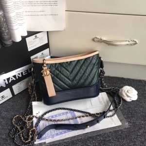 CHANEL Gabrielle Leather Hobo Bag. Authentic quality luxury bag crafted in genuine leather comes with authenticity card, dust bag and gift bag. Embodying the Future of Chanel with a Bold and Unforgettable Style. In an exclusive Chanel video, Karl Lagerfeld expressed his belief that the latest bag style, the Gabrielle, pays homage to Chanel's founder, Gabrielle Bonheur "Coco" Chanel. Lagerfeld explained that while she was known as Coco, her real name was Gabrielle, a fitting name for a handbag that embodies all the signature codes of Chanel. We wholeheartedly agree with Lagerfeld's sentiment. The Gabrielle is undeniably "perfectly Chanel", but with a fresh and bold twist. The inspiration behind the Chanel Gabrielle bag can be traced to virtual reality glasses and the binocular cases that men used to carry over their shoulders at the racecourse. While the bag incorporates iconic Chanel elements like quilting and a prominent CC logo, it has a distinct futuristic edge, as evident in its boxy shape. As per Chanel's literature, carrying the Gabrielle bag offers a truly unique experience. Its double straps can be effortlessly draped over the head, mimicking the ease of slipping on a sweater, and nonchalantly encircled around the neck and shoulder, resembling a long necklace. Karl Lagerfeld even emphasizes that the bag's strong aesthetic is reflective of the individuals who represent it, possessing equally strong looks and personalities. - KRIS + KIKO CHANEL Gabrielle Leather Hobo Bag. Original Quality Bag including gift box, care book, dust bag, authenticity card. As stated by Karl Lagerfeld in an exclusive Chanel video, this latest bag style is really meant to pay homage Chanel’s founder, Gabrielle Bonheur “Coco” Chanel: “Everyone called her Coco but her real name was Gabrielle. It’s the perfect name for a handbag that has all the codes of Chanel.” We agree with Lagerfeld. The Gabrielle hits the mark on everything “perfectly Chanel”, with a fresh, bold twist.” The Chanel Gabrielle bag is inspired by virtual reality glasses and the binocular cases men used to wear over their shoulders at the racecourse. The bag features other iconic Chanel elements like quilting and a big CC logo, but overall this bag is supposed to have a futuristic edge as seen by its boxy shape. According to literature from Chanel, the experience of carrying the Gabrielle bag is truly unique. Its double straps can be passed over the head, like a sweater, and circled around the neck and shoulder nonchalantly, like a long necklace. Karl Lagerfeld even goes as far to state that “the handbag has a strong look, so the people who represent it have strong looks and personalities.”