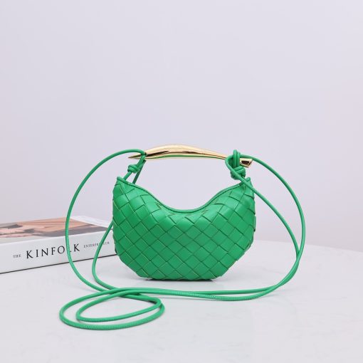 BOTTEGA VENETA Mini Sardine. Authentic quality luxury bag crafted in genuine leather comes with authenticity card, dust bag and gift bag. Crafted to Perfection, Inspired by Nature: Your Timeless Companion for All Occasions. BOTTEGA VENETA's masterful intrecciato weaving technique was originally crafted to ensure the enduring quality of leather goods. The Sardine Mini leather shoulder bag, meticulously fashioned from supple lamb leather, showcases a distinctive top handle reminiscent of a graceful fish. This versatile piece seamlessly transitions from day to night, making it the perfect, reliable companion to elegantly accommodate all your essentials.