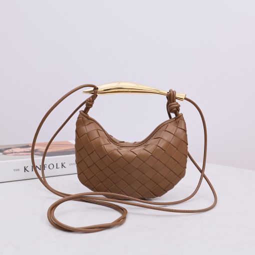 BOTTEGA VENETA Mini Sardine. Authentic quality luxury bag crafted in genuine leather comes with authenticity card, dust bag and gift bag. Crafted to Perfection, Inspired by Nature: Your Timeless Companion for All Occasions. BOTTEGA VENETA's masterful intrecciato weaving technique was originally crafted to ensure the enduring quality of leather goods. The Sardine Mini leather shoulder bag, meticulously fashioned from supple lamb leather, showcases a distinctive top handle reminiscent of a graceful fish. This versatile piece seamlessly transitions from day to night, making it the perfect, reliable companion to elegantly accommodate all your essentials.