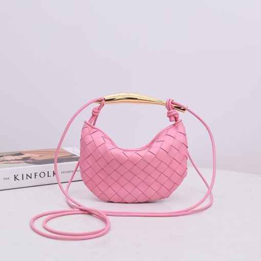 BOTTEGA VENETA Mini Sardine. Authentic quality luxury bag crafted in genuine leather comes with authenticity card, dust bag and gift bag. Crafted to Perfection, Inspired by Nature: Your Timeless Companion for All Occasions. BOTTEGA VENETA's masterful intrecciato weaving technique was originally crafted to ensure the enduring quality of leather goods. The Sardine Mini leather shoulder bag, meticulously fashioned from supple lamb leather, showcases a distinctive top handle reminiscent of a graceful fish. This versatile piece seamlessly transitions from day to night, making it the perfect, reliable companion to elegantly accommodate all your essentials.