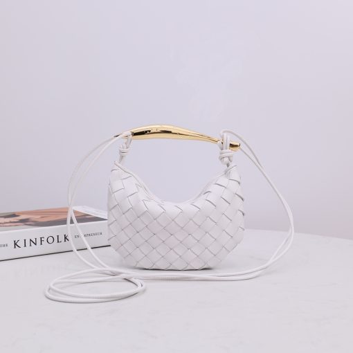 BOTTEGA VENETA Mini Sardine. Authentic quality luxury bag crafted in genuine leather comes with authenticity card, dust bag and gift bag. Crafted to Perfection, Inspired by Nature: Your Timeless Companion for All Occasions. BOTTEGA VENETA's masterful intrecciato weaving technique was originally crafted to ensure the enduring quality of leather goods. The Sardine Mini leather shoulder bag, meticulously fashioned from supple lamb leather, showcases a distinctive top handle reminiscent of a graceful fish. This versatile piece seamlessly transitions from day to night, making it the perfect, reliable companion to elegantly accommodate all your essentials.