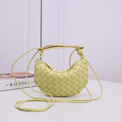 BOTTEGA VENETA Mini Sardine. Authentic quality luxury bag crafted in genuine leather comes with authenticity card, dust bag and gift bag. Crafted to Perfection, Inspired by Nature: Your Timeless Companion for All Occasions. BOTTEGA VENETA's masterful intrecciato weaving technique was originally crafted to ensure the enduring quality of leather goods. The Sardine Mini leather shoulder bag, meticulously fashioned from supple lamb leather, showcases a distinctive top handle reminiscent of a graceful fish. This versatile piece seamlessly transitions from day to night, making it the perfect, reliable companion to elegantly accommodate all your essentials.