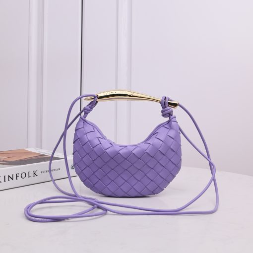 BOTTEGA VENETA Mini Sardine. Authentic quality luxury bag crafted in genuine leather comes with authenticity card, dust bag and gift bag. Crafted to Perfection, Inspired by Nature: Your Timeless Companion for All Occasions. BOTTEGA VENETA's masterful intrecciato weaving technique was originally crafted to ensure the enduring quality of leather goods. The Sardine Mini leather shoulder bag, meticulously fashioned from supple lamb leather, showcases a distinctive top handle reminiscent of a graceful fish. This versatile piece seamlessly transitions from day to night, making it the perfect, reliable companion to elegantly accommodate all your essentials.